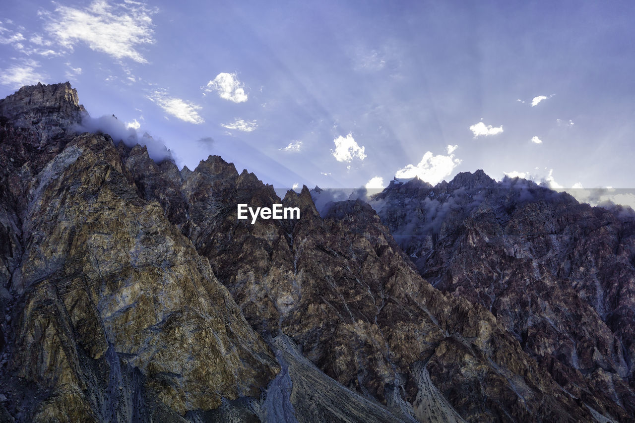 Low angle view of rocks against sky