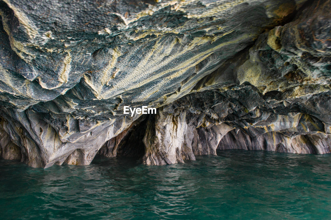 View of sea by rock formation