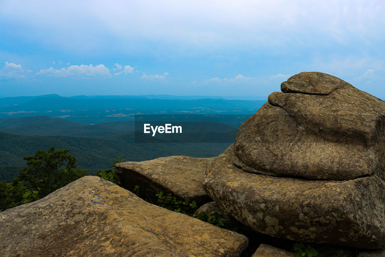 rock, scenics - nature, sky, landscape, environment, nature, mountain, wilderness, beauty in nature, cloud, land, tranquility, geology, travel destinations, no people, tranquil scene, ridge, travel, non-urban scene, boulder, outdoors, sea, terrain, mountain range, tourism, water, day, adventure, history, architecture