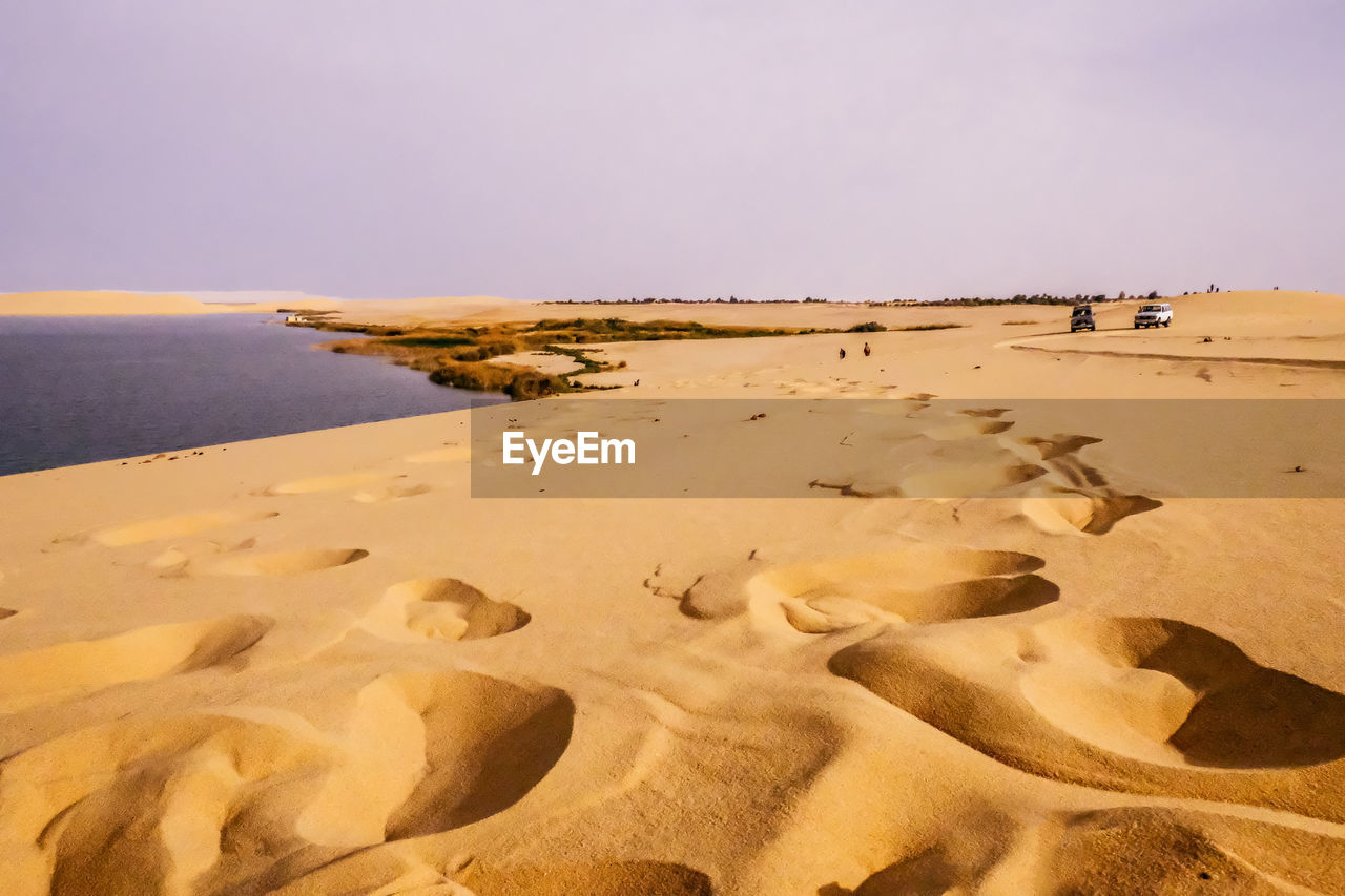 Scenic view of beach against clear sky