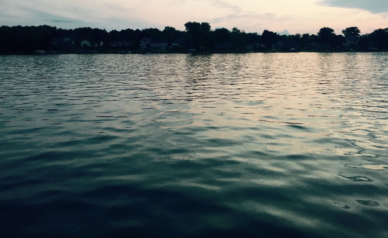 SCENIC VIEW OF LAKE AT SUNSET