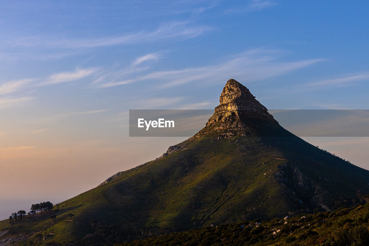 sky, mountain, landscape, environment, beauty in nature, scenics - nature, travel destinations, nature, cloud, land, travel, sunset, tourism, no people, rock, horizon, non-urban scene, outdoors, architecture, volcano, history, tranquility, mountain peak, dawn, the past, plateau, tranquil scene, mountain range