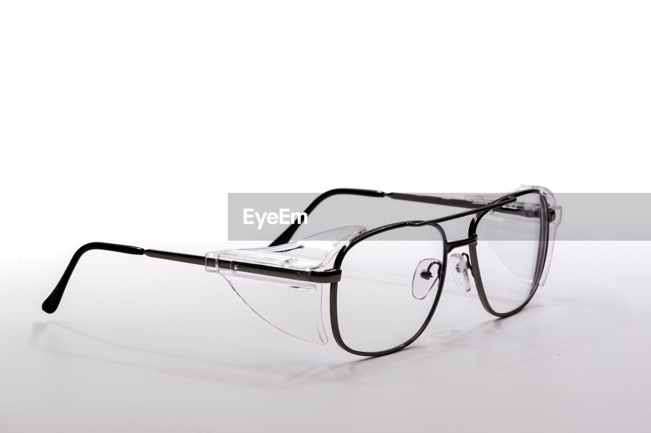 Close-up of eyeglasses against white background