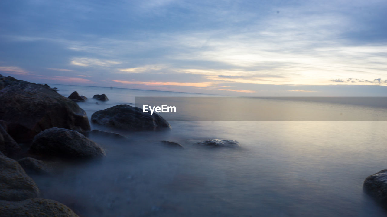 Scenic view of sea against sky at sunset