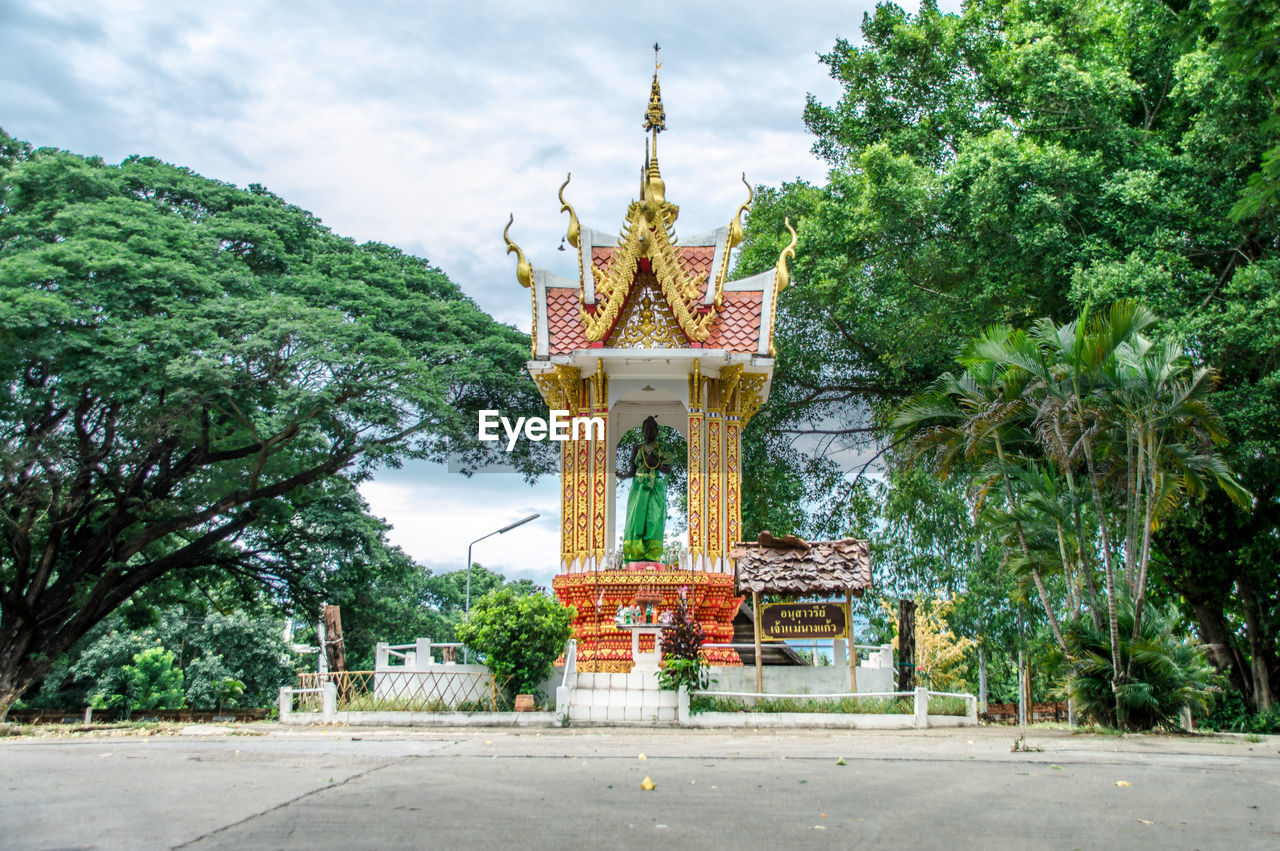 EXTERIOR OF TEMPLE AGAINST BUILDING