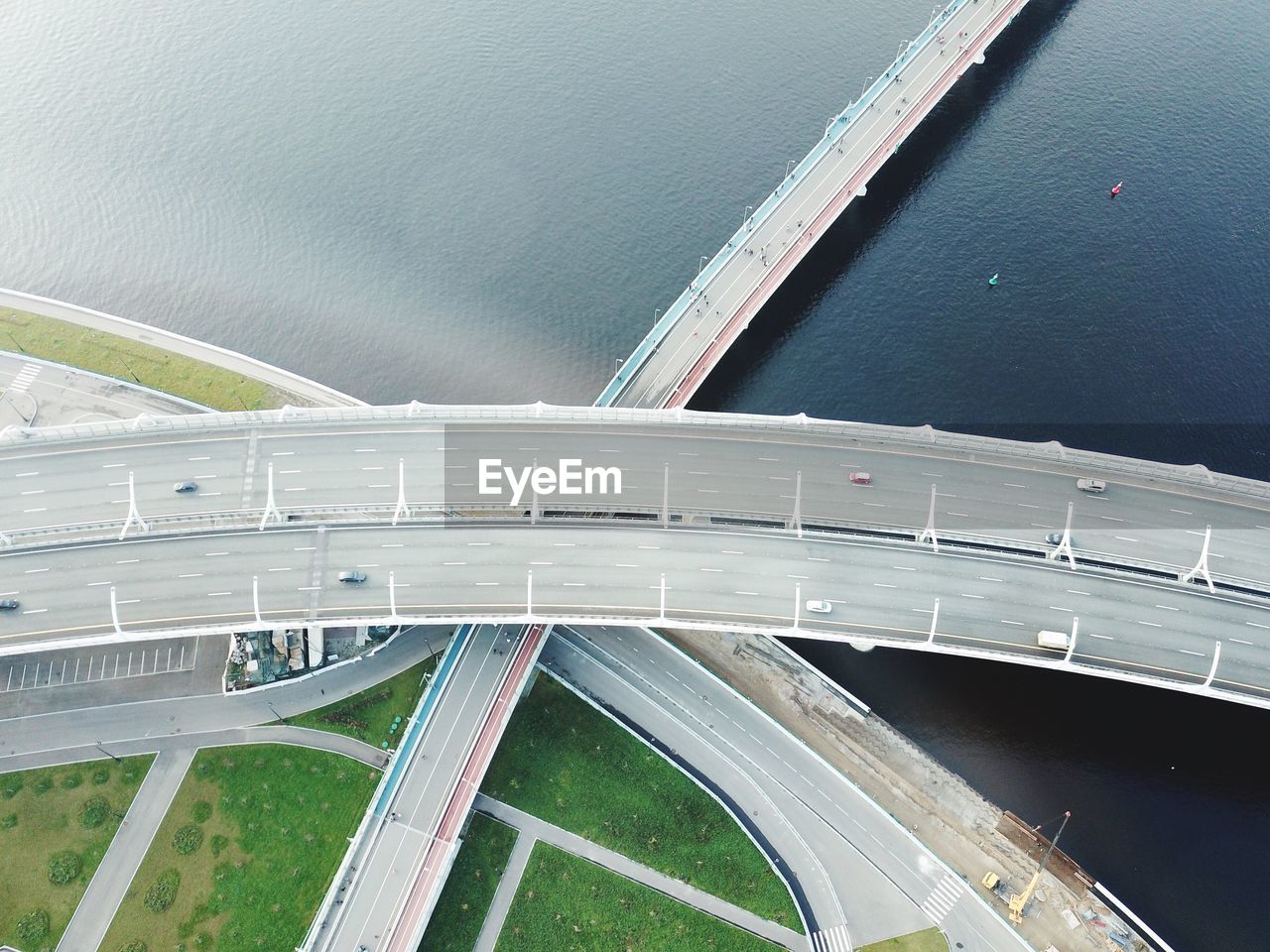 Aerial view of elevated bridge over river in city