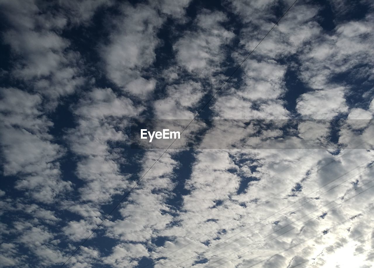 LOW ANGLE VIEW OF CLOUDS IN BLUE SKY