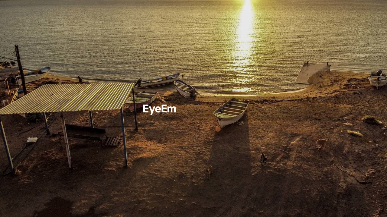 High angle view of abandoned beach against sky during sunset