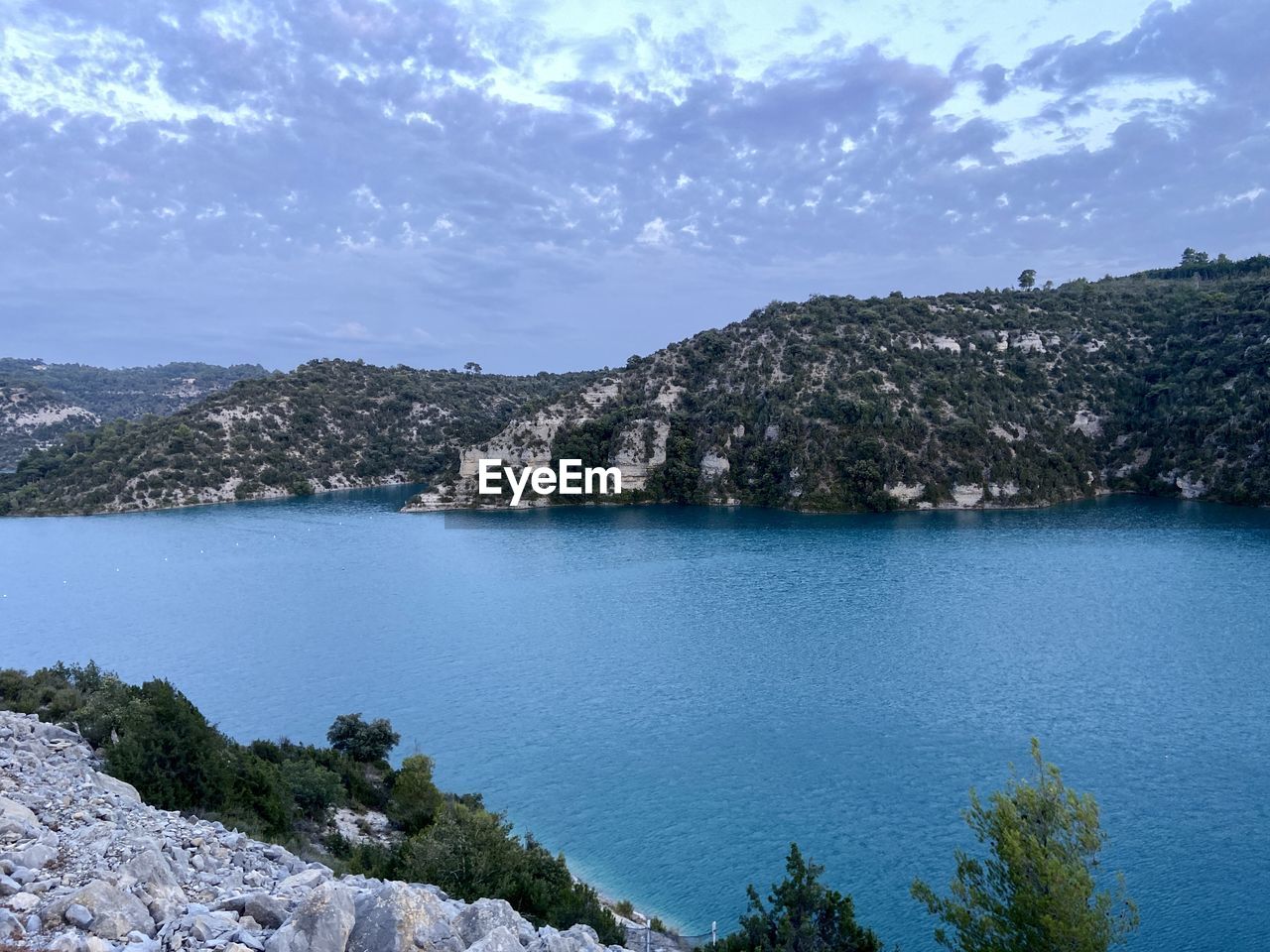 water, scenics - nature, sky, body of water, beauty in nature, lake, mountain, nature, land, environment, tree, landscape, cloud, tranquility, reservoir, tranquil scene, travel destinations, plant, no people, beach, pinaceae, pine tree, travel, crater lake, coniferous tree, blue, tourism, outdoors, rock, forest, bay, non-urban scene, idyllic, shore, pine woodland, day, mountain range, coastline, coast, reflection, architecture, trip, vacation