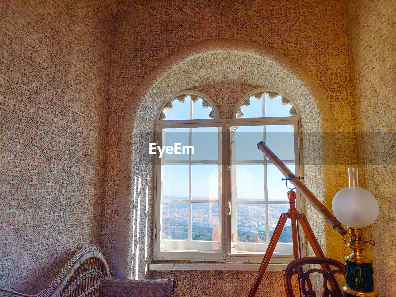 Day photography of astronomy room with telescope facing window at palacio da pena, sintra, portugal