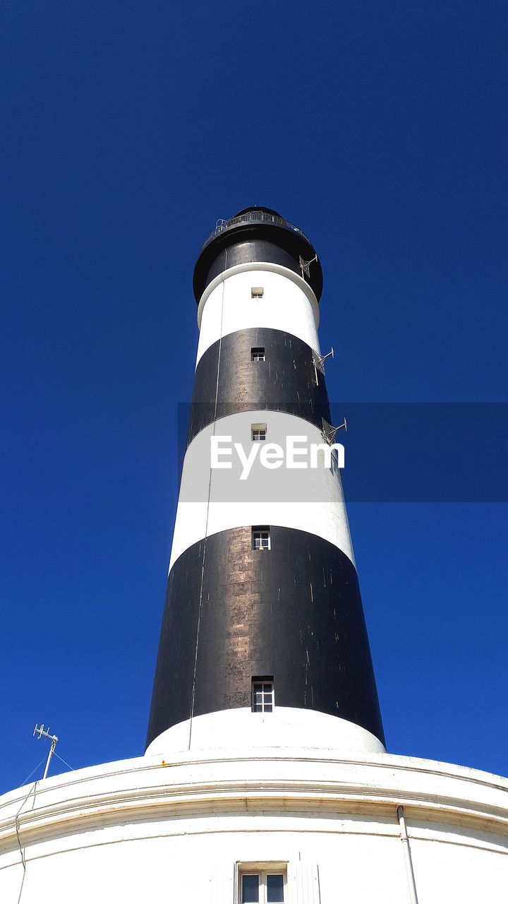 Low angle view of lighthouse against clear sky