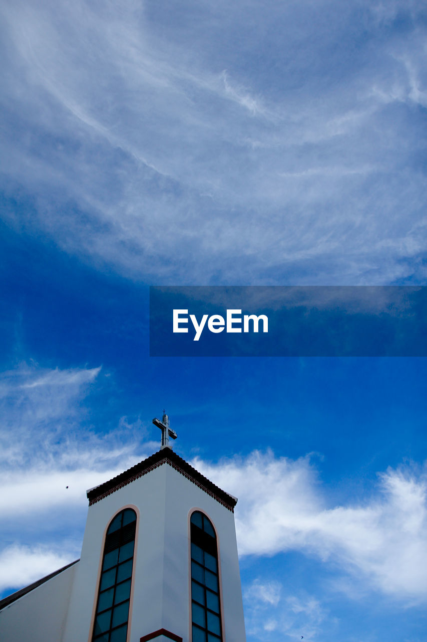 Low angle view of building against blue sky