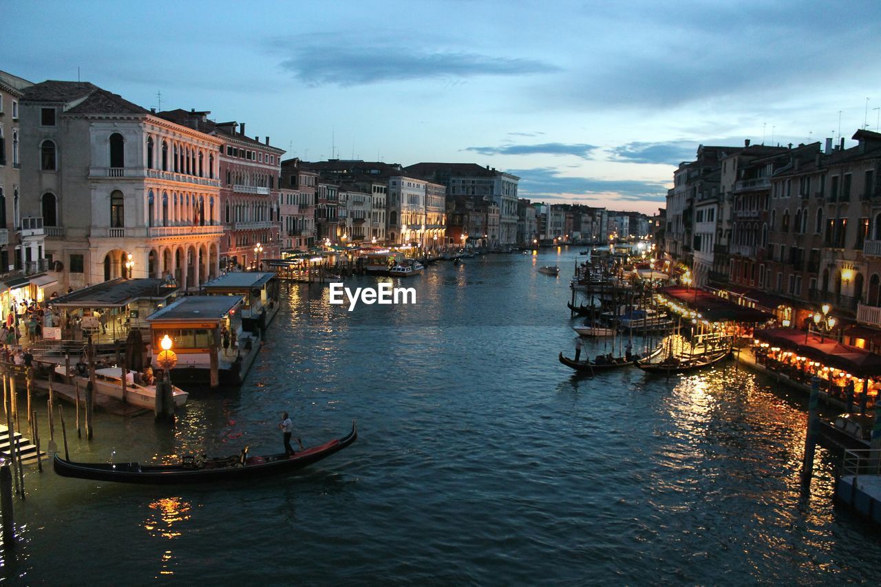 Canal in city at night