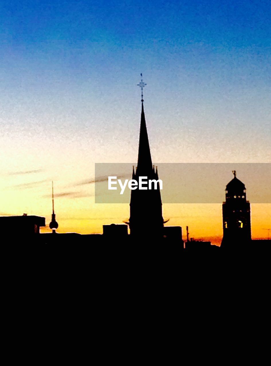 LOW ANGLE VIEW OF CHURCH AT SUNSET