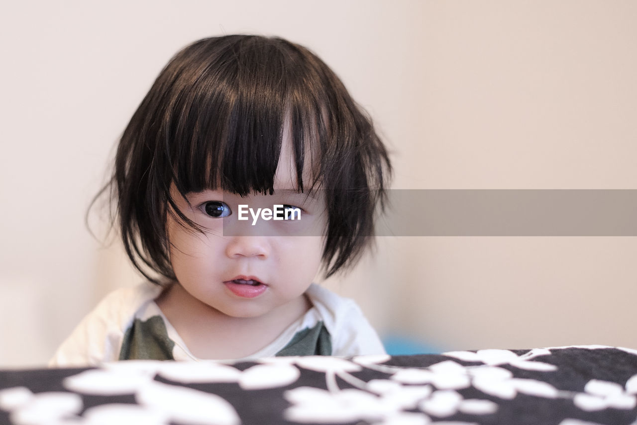 Close-up of cute girl at home