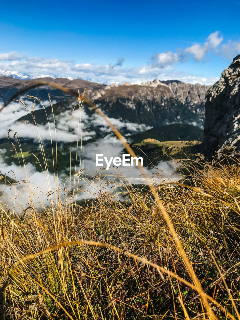 Aerial view of land and mountains against sky