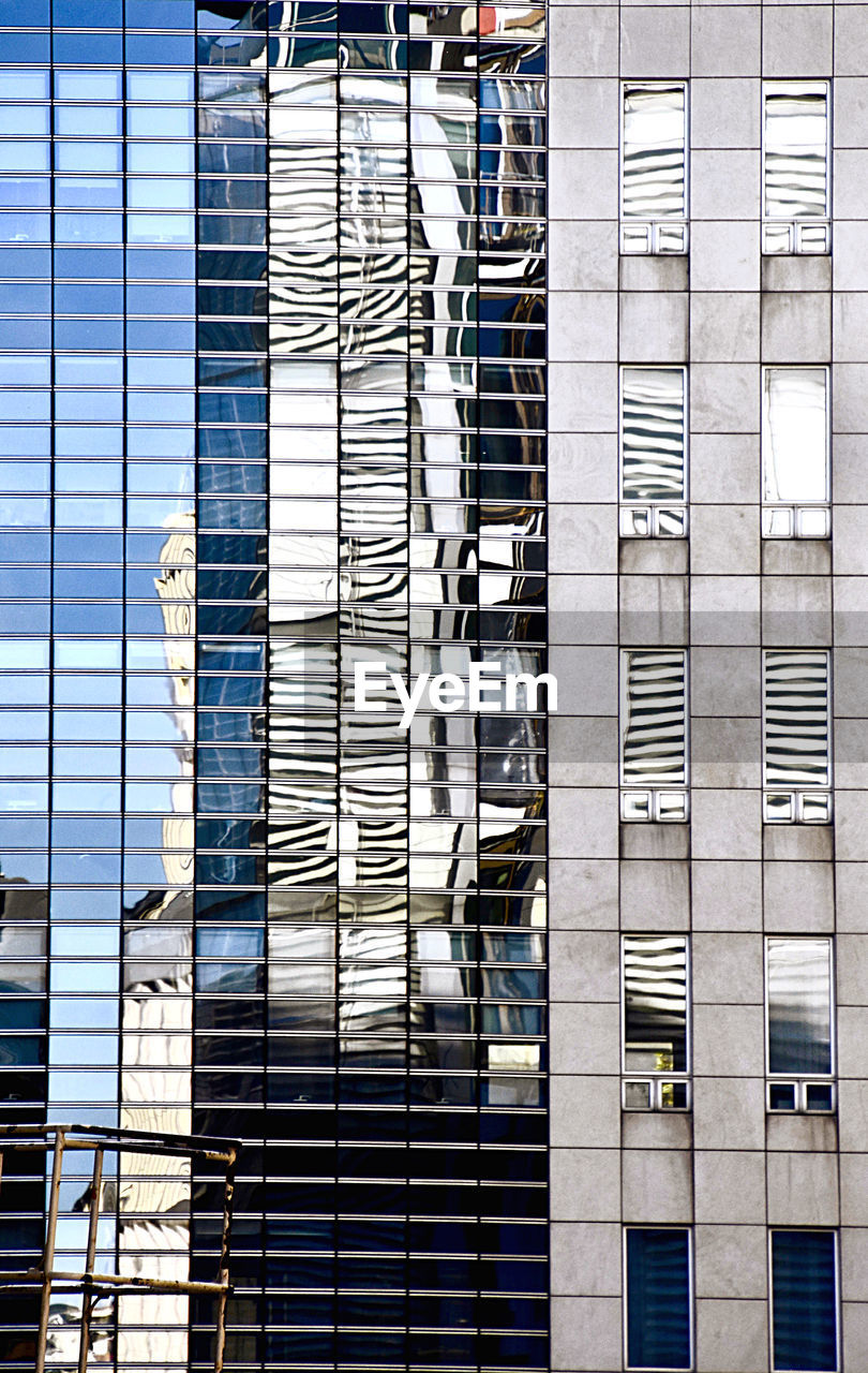 LOW ANGLE VIEW OF GLASS BUILDING