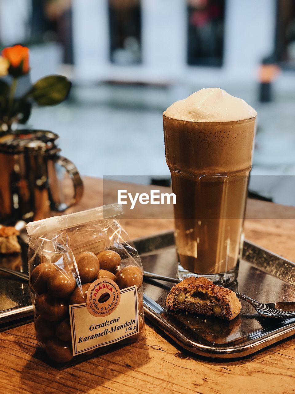 CLOSE-UP OF COFFEE AND GLASS ON TABLE