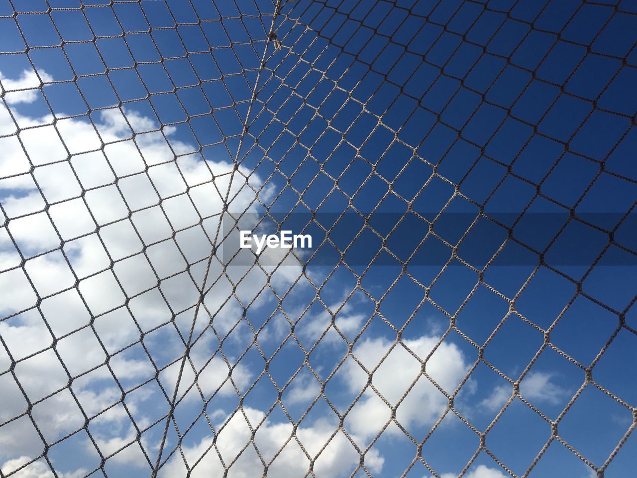 LOW ANGLE VIEW OF CHAINLINK FENCE