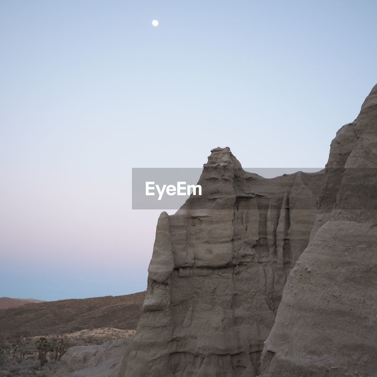 View of rocky mountains against clear sky