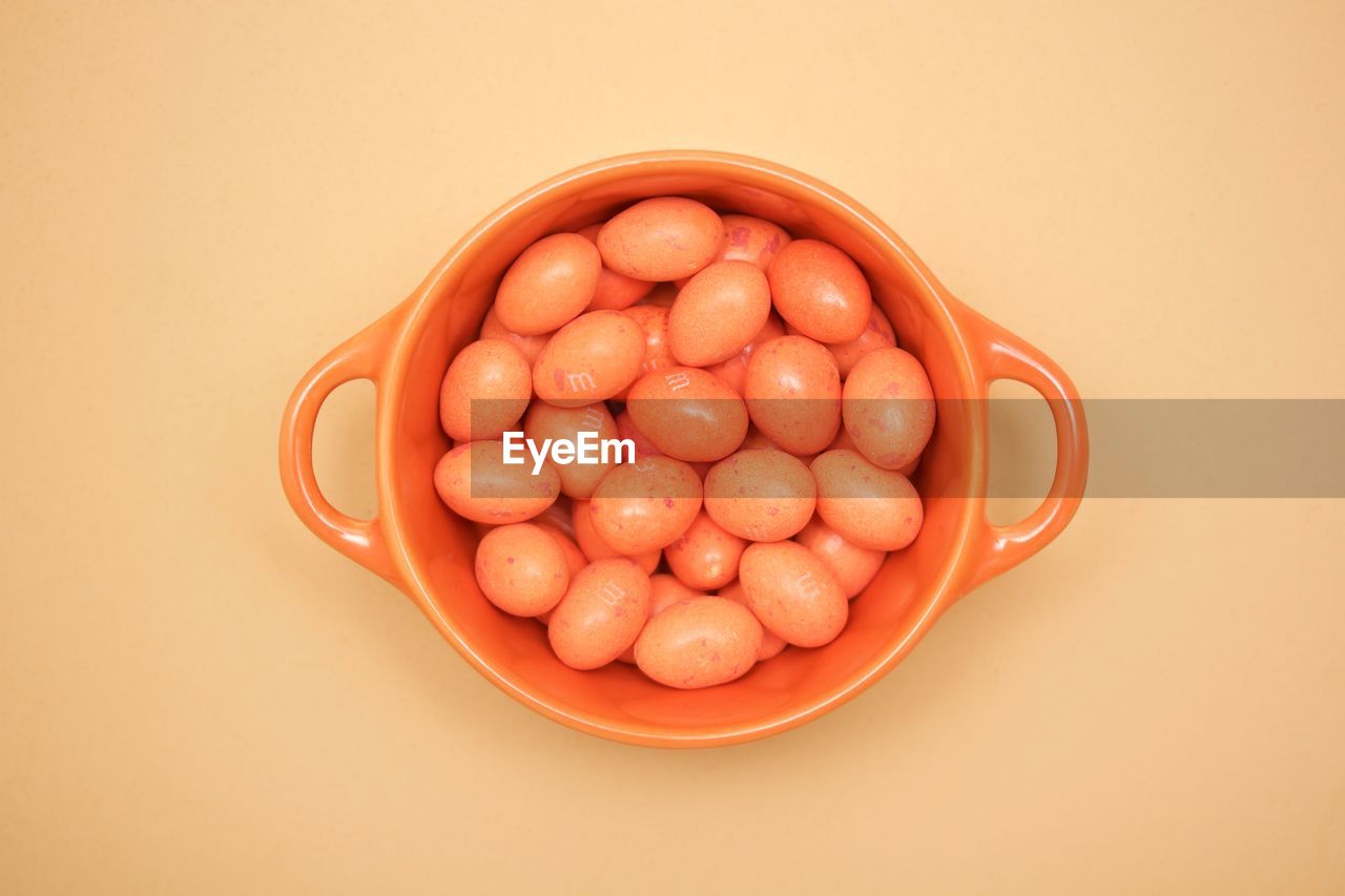 Directly above shot of easter eggs candies in bowl