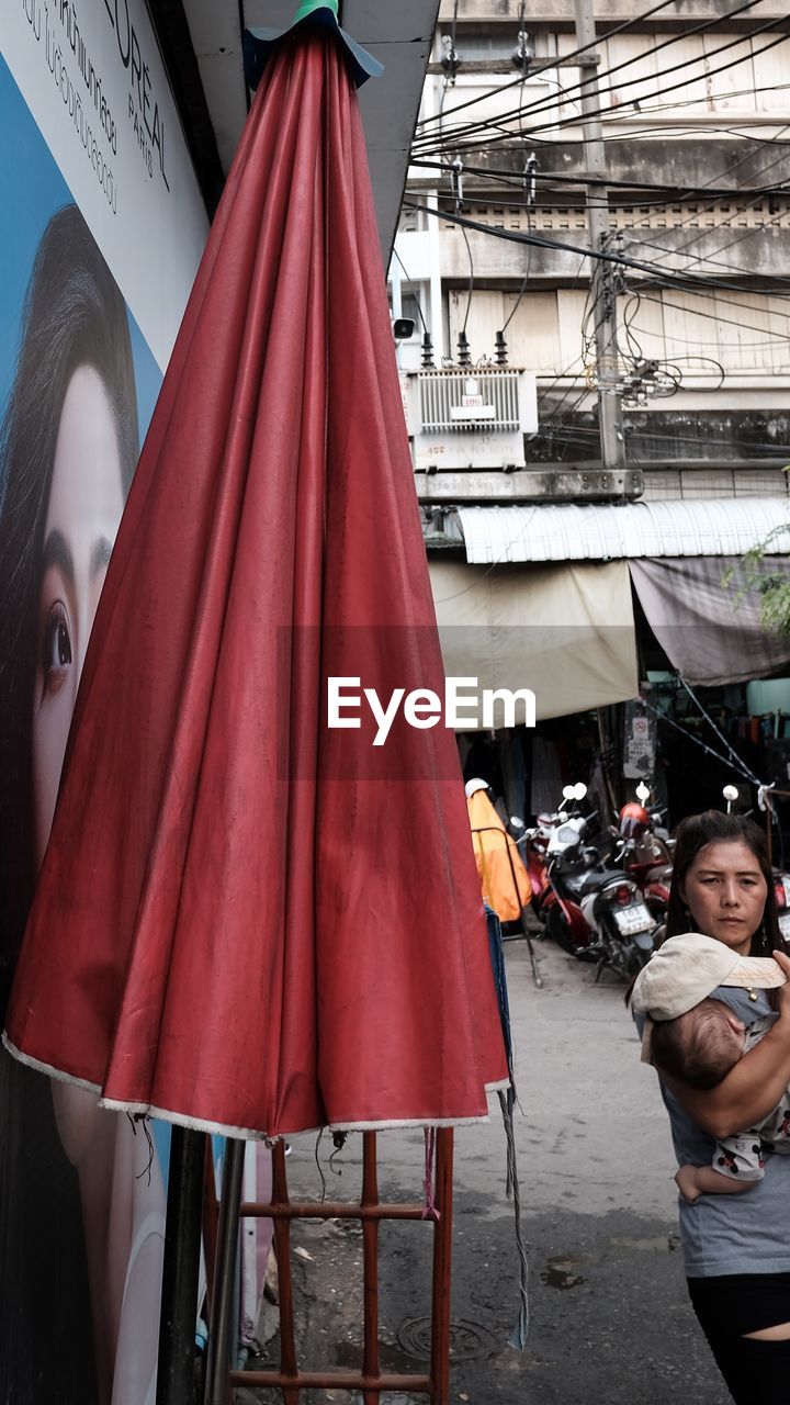 PEOPLE STANDING AT MARKET