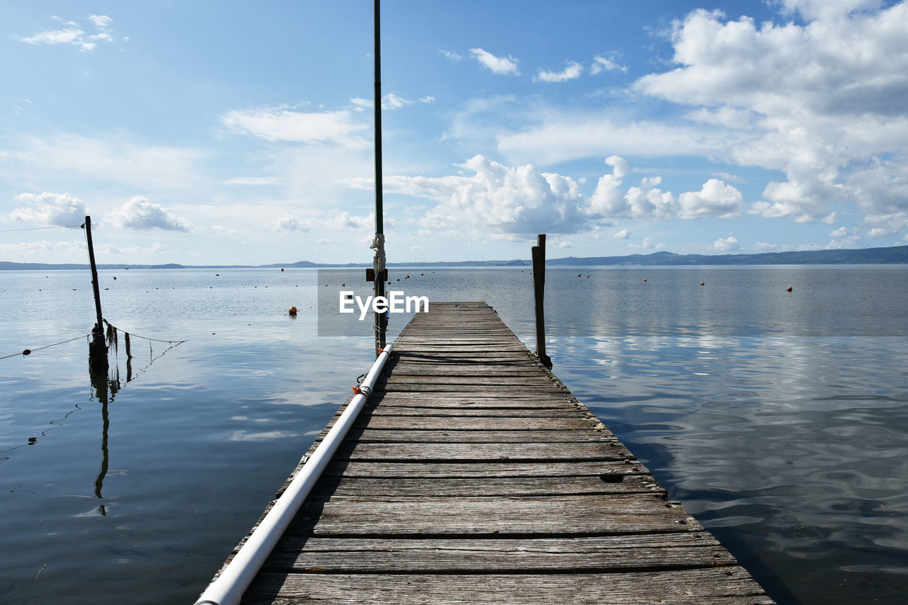 WOODEN JETTY ON PIER OVER SEA