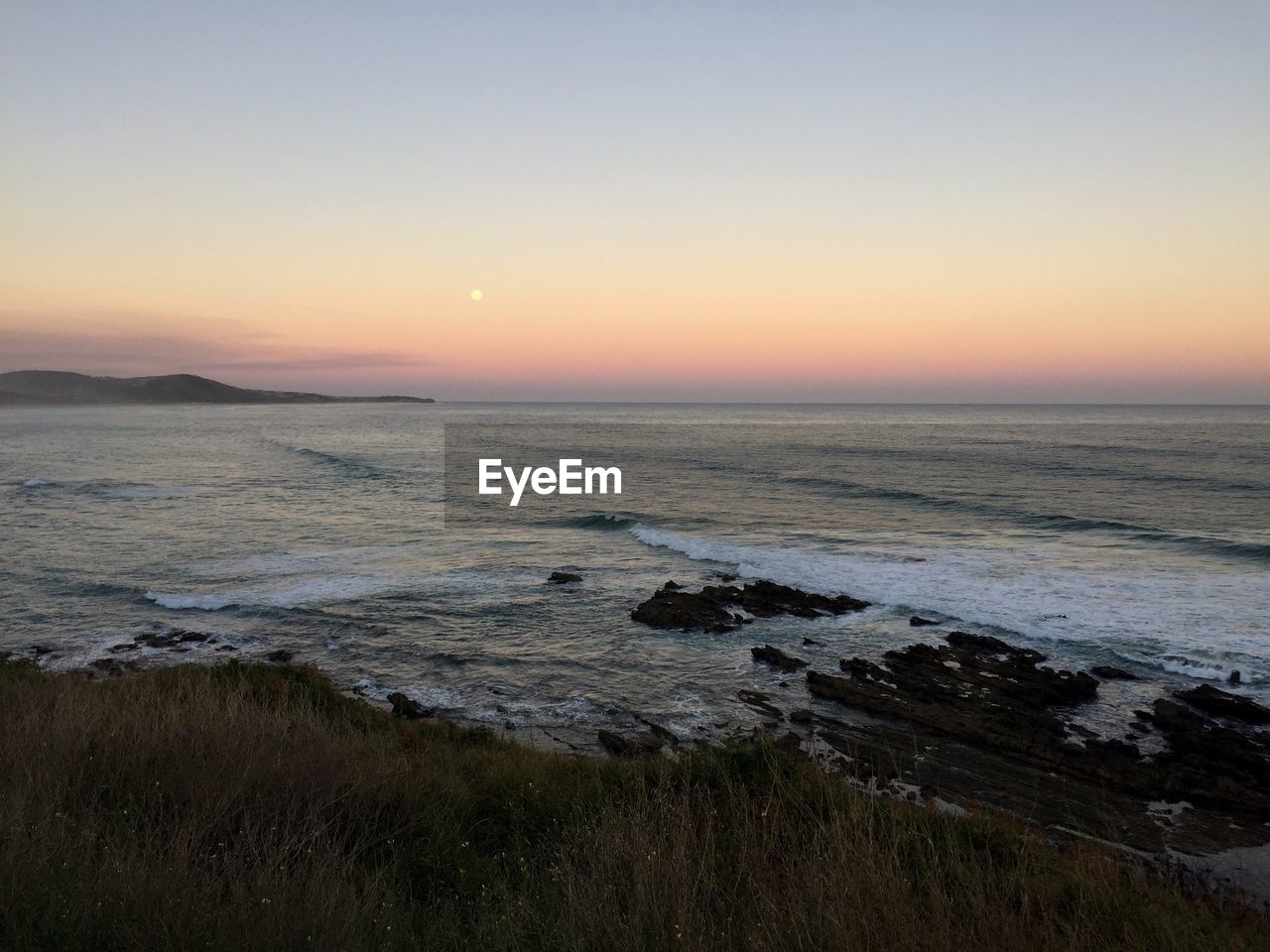 Scenic view of sea during sunset