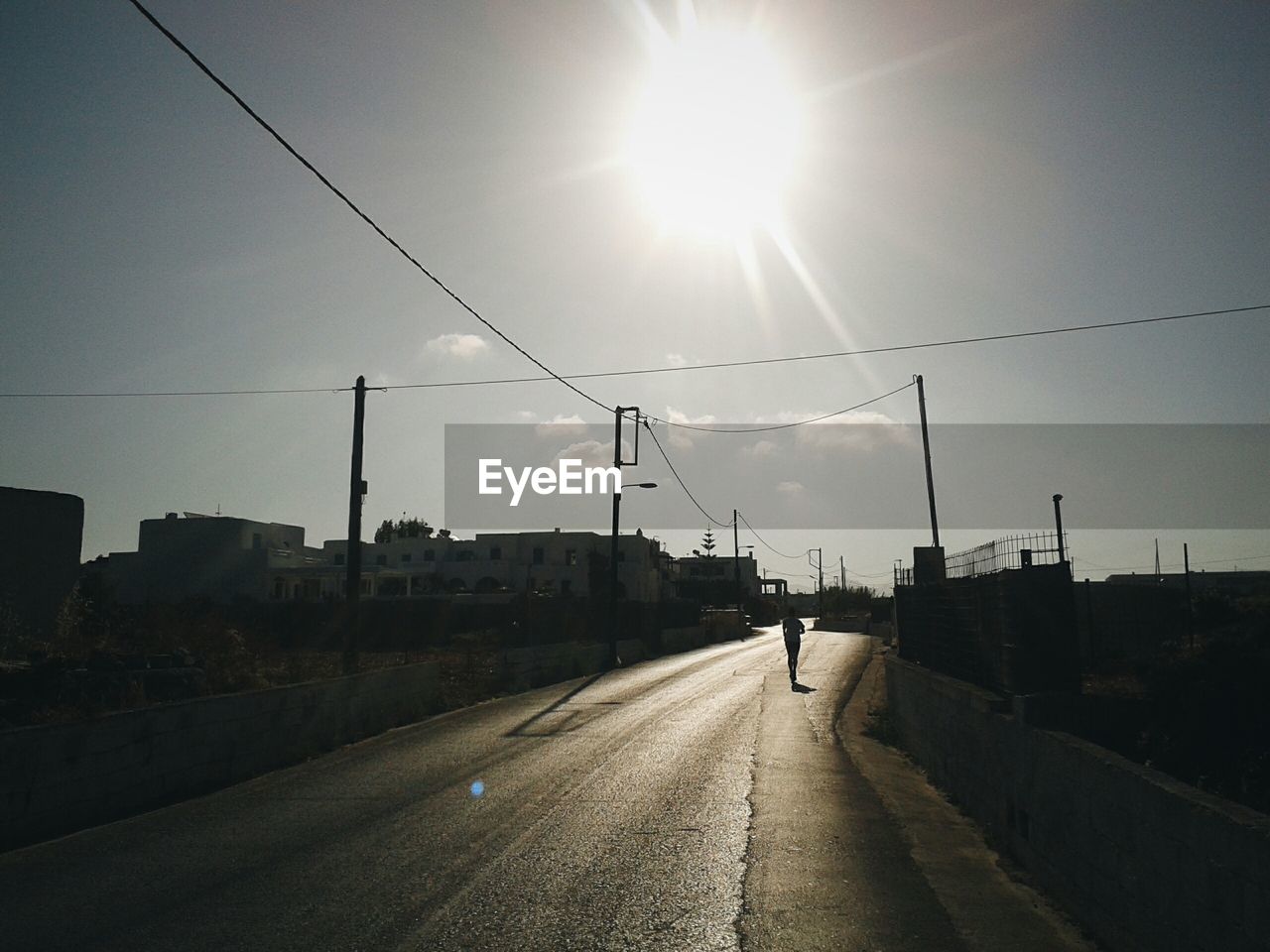 Road against sky during sunny day