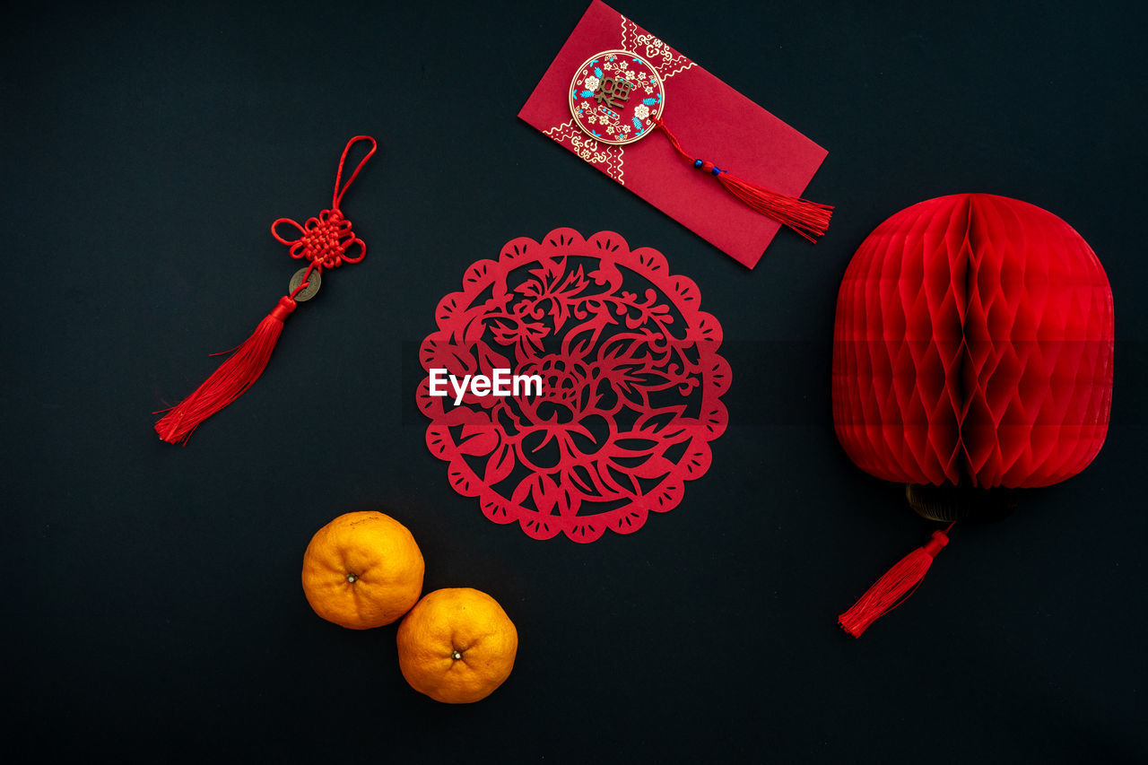 Chinese lunar new year decoration over black background. flat lay concept festive decoration. 