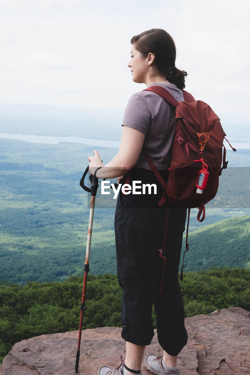 FULL LENGTH OF MAN STANDING ON MOUNTAIN