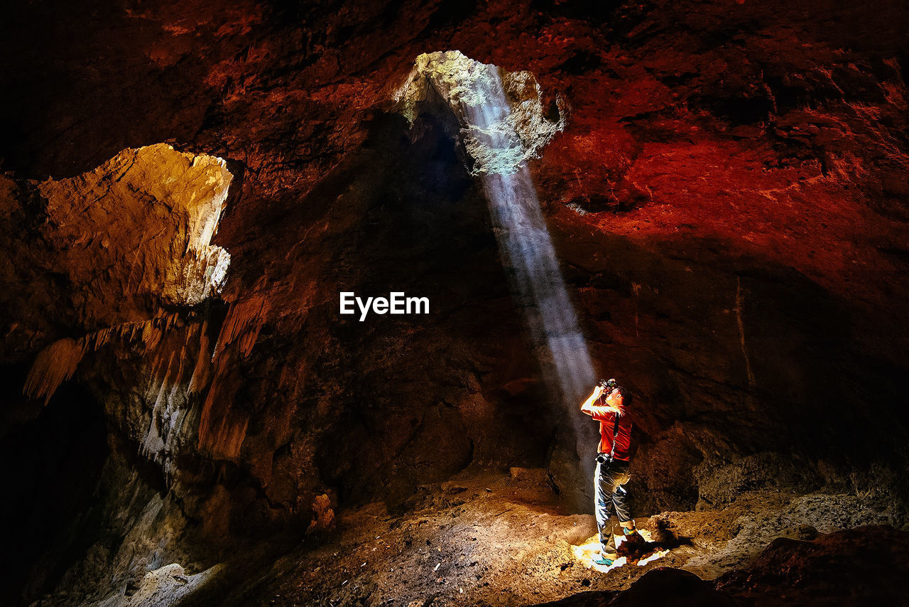 Man standing in cave