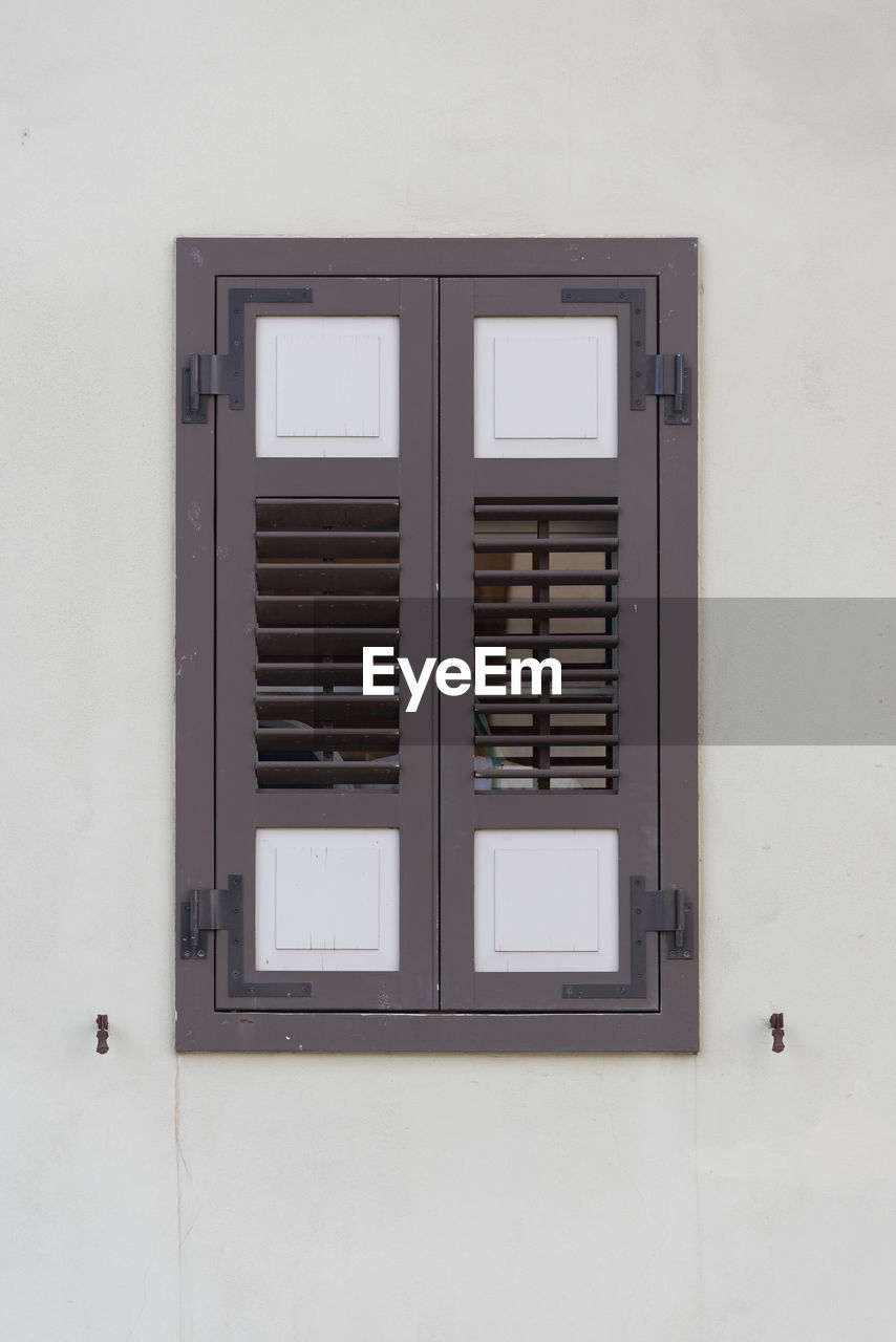 An old wooden window on a stone wall, sarona, tel aviv, israel