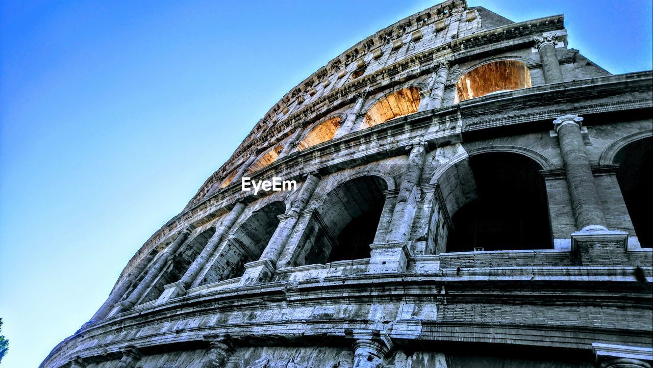 Low angle view of amphitheater against clear sky