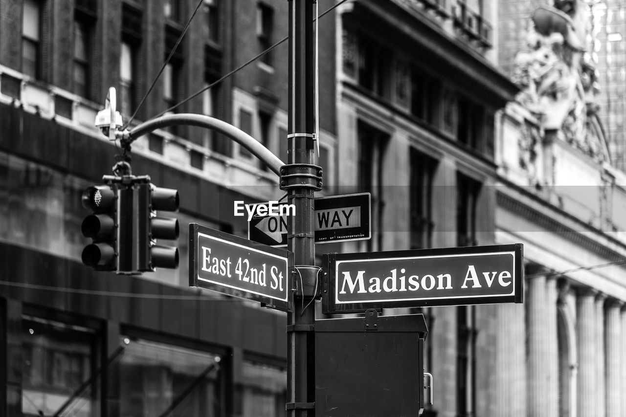 Signboard and road signal in city