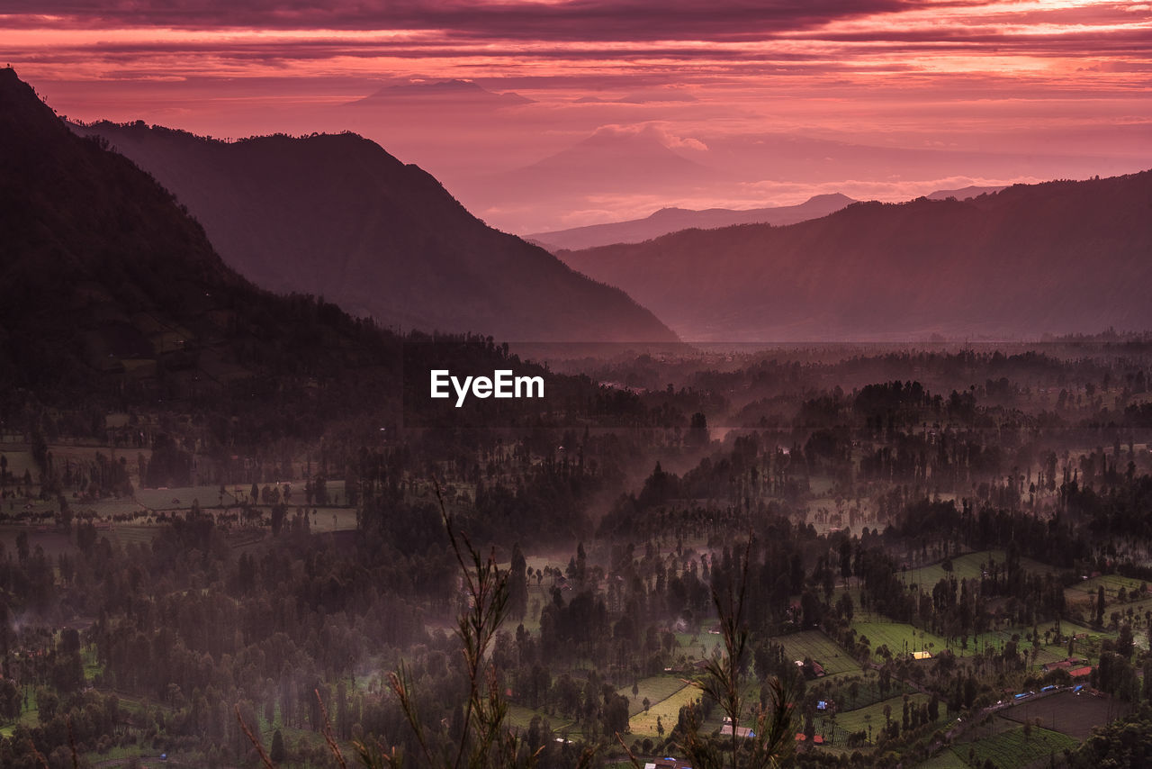 Scenic view of dramatic landscape during sunset