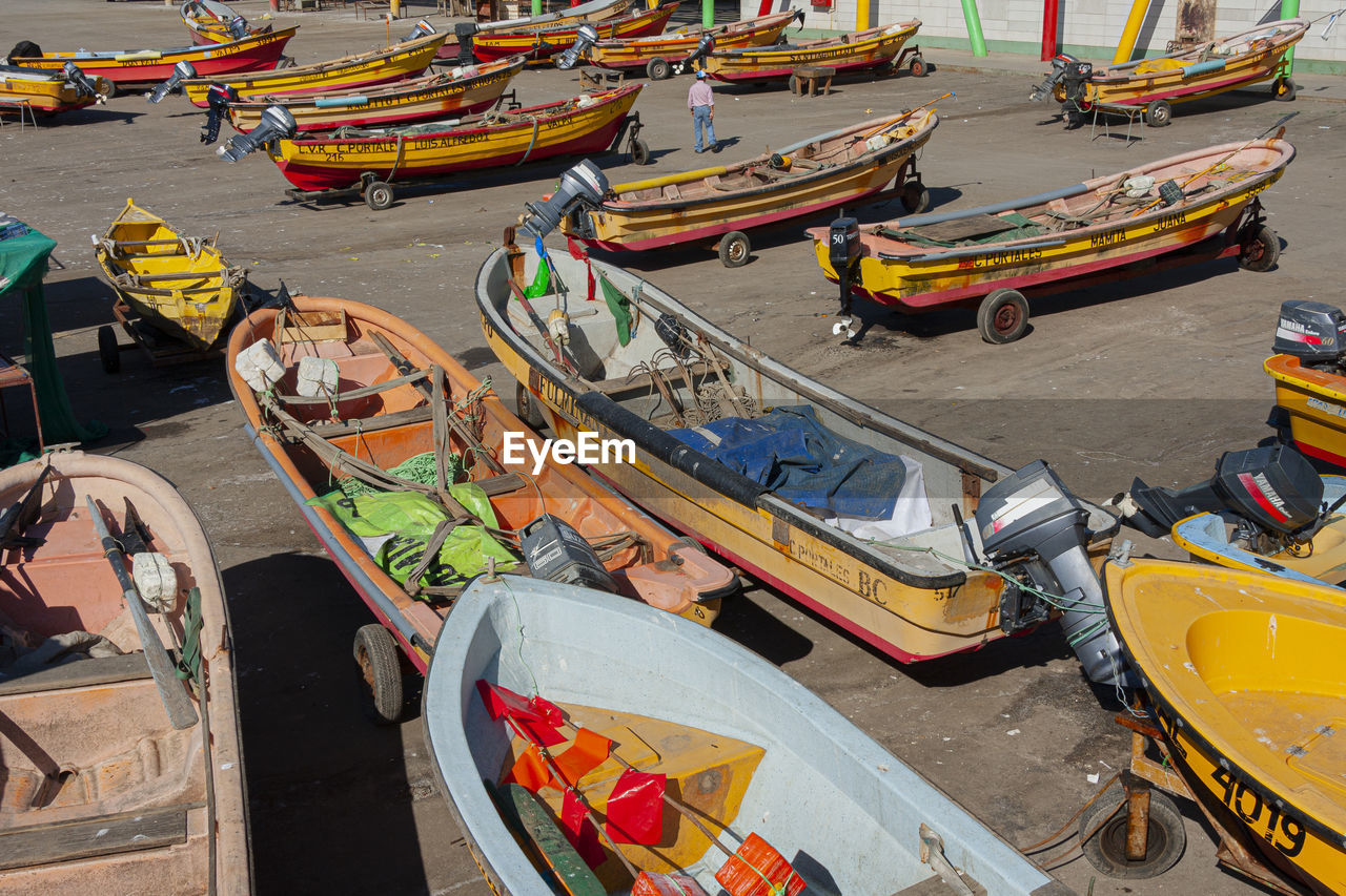 HIGH ANGLE VIEW OF BOATS MOORED IN HARBOR