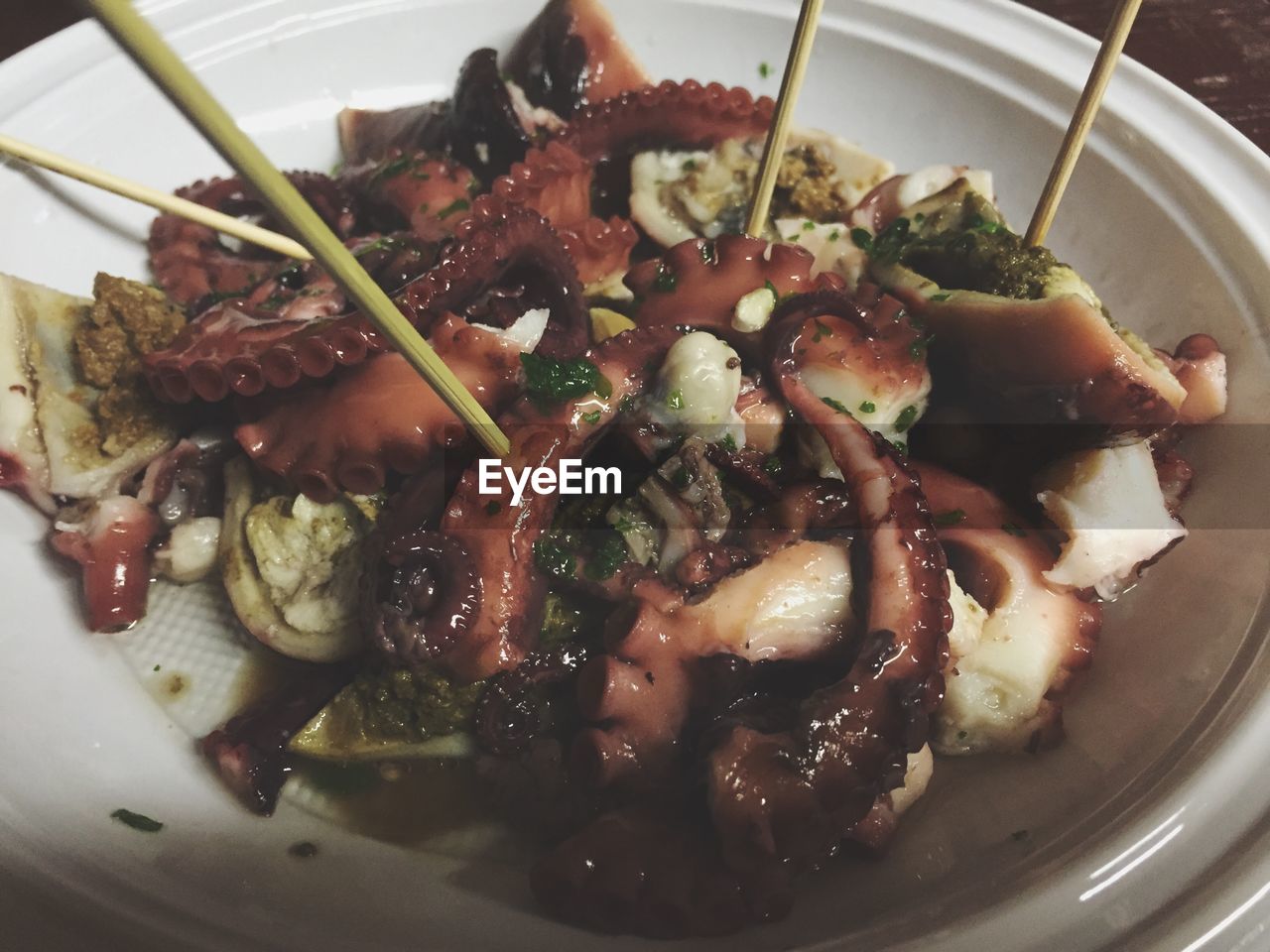 Close-up of octopus in plate on table