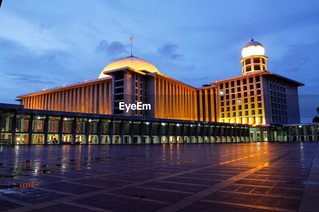 VIEW OF ILLUMINATED BUILDINGS AGAINST SKY