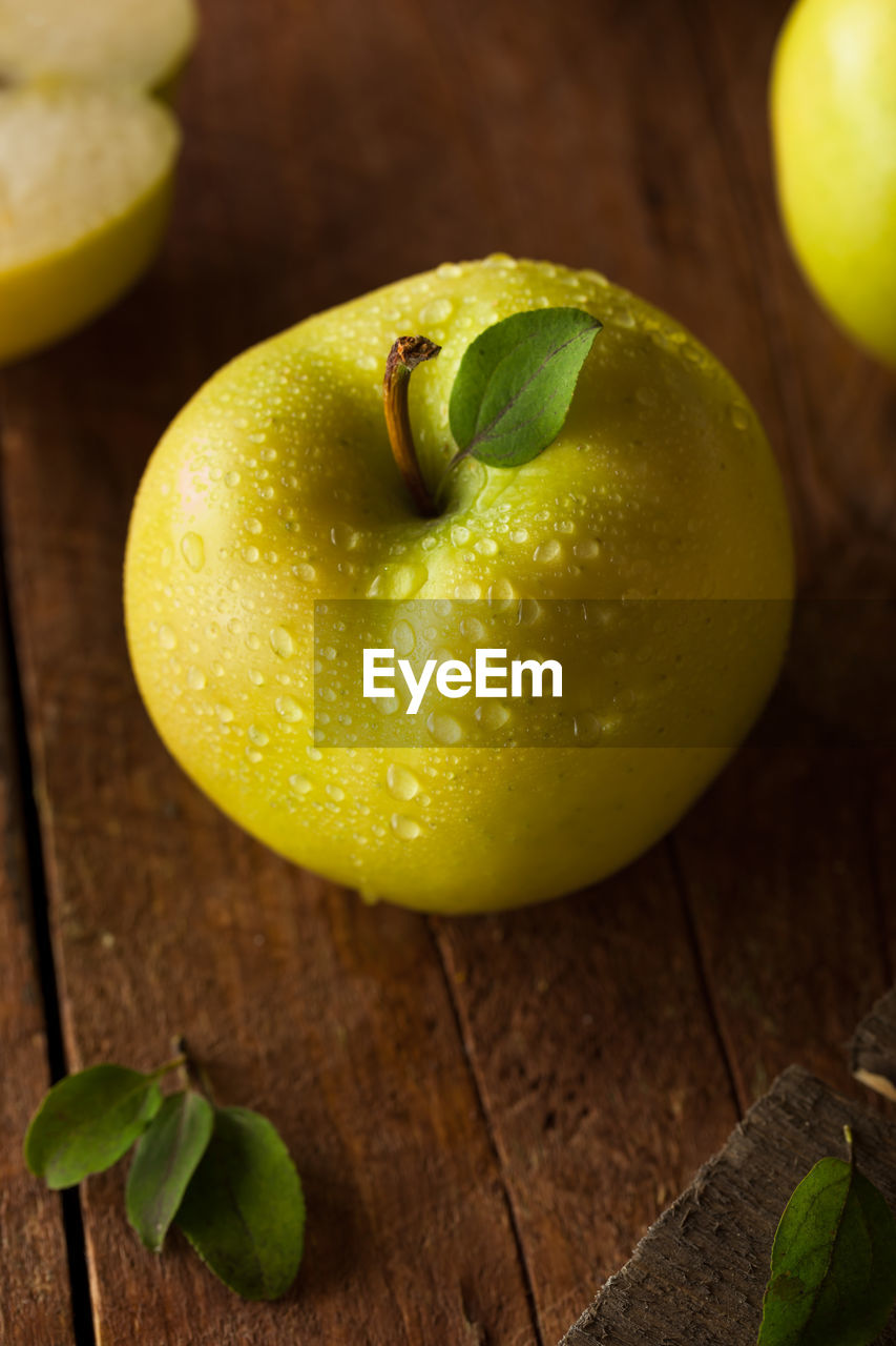 close-up of apples on wooden table