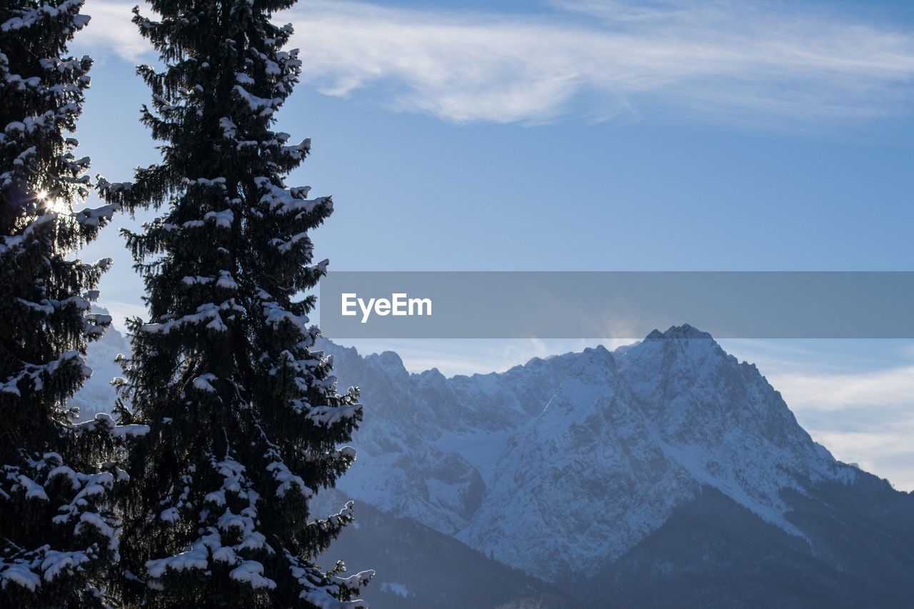 Scenic view of mountains against sky during winter