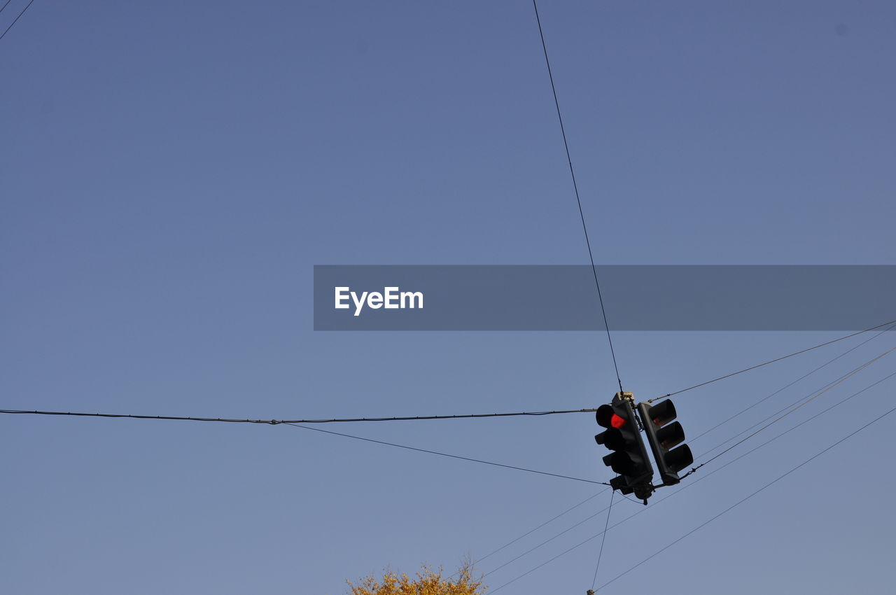 LOW ANGLE VIEW OF OVERHEAD CABLE CAR AGAINST SKY