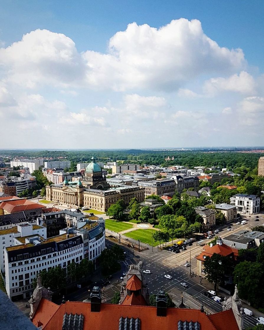 High angle view of cityscape against cloudy sky