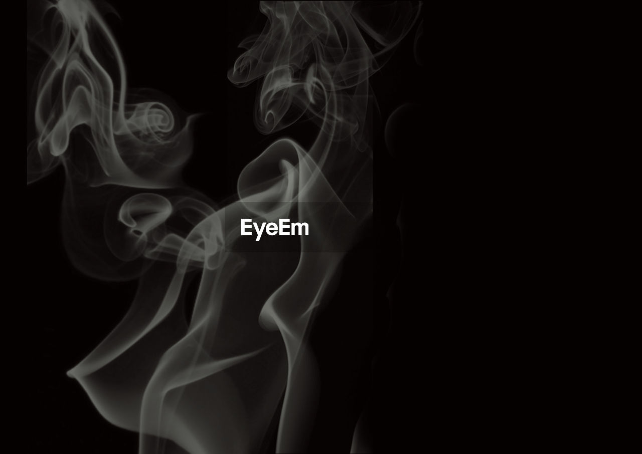 Close up of smoke against black background