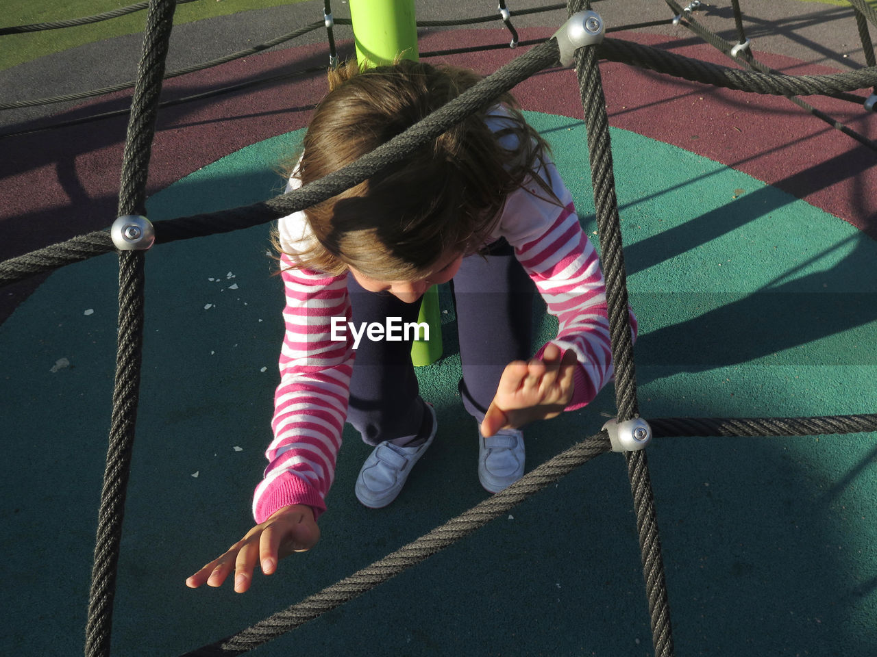 High angle view of girl playing at playground