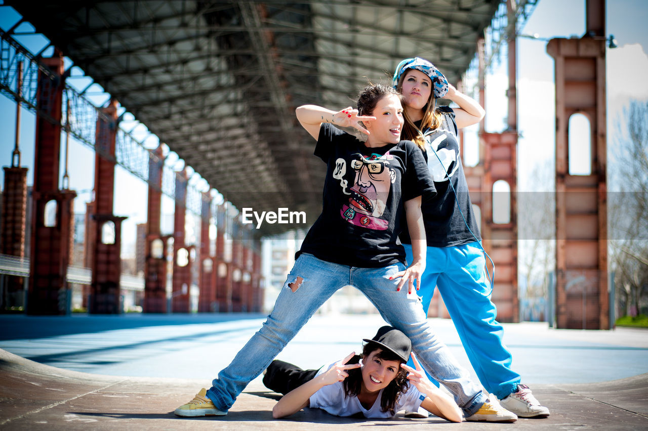 Full length portrait of female dancers on street