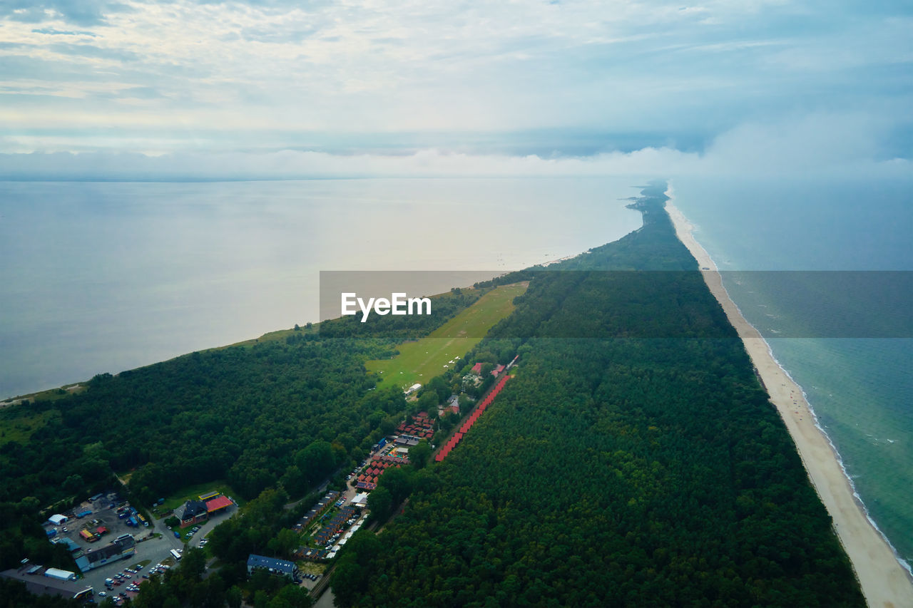 Aerial view of baltic sea beach with swimming people in wladyslawowo, poland