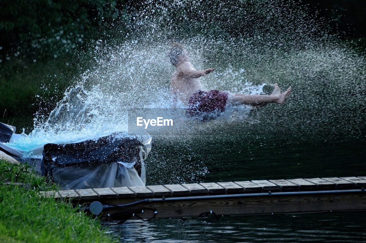 MAN SWIMMING IN POOL