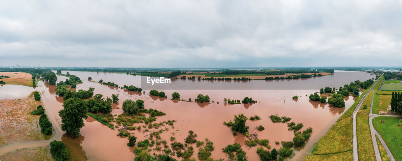 water, sky, land, environment, cloud, nature, landscape, sea, scenics - nature, panoramic, plant, beauty in nature, travel, beach, travel destinations, tree, tourism, coast, tranquility, no people, outdoors, architecture, day, shore, aerial photography, rural scene, tranquil scene, horizon, lagoon, coastline, high angle view, vacation, trip, holiday, non-urban scene, horizon over water, agriculture, tropical climate, sand, building, aerial view