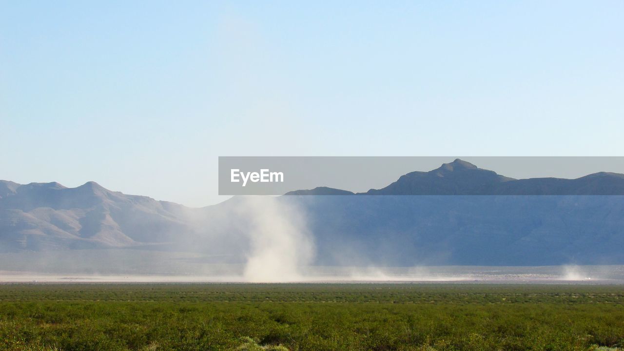 Scenic view of dust devil against clear sky